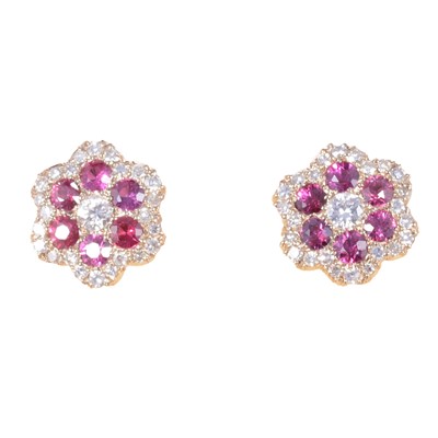 Lot 258 - A pair of ruby and diamond earstuds.