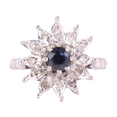 Lot 28 - A vintage sapphire and diamond floral cluster ring.