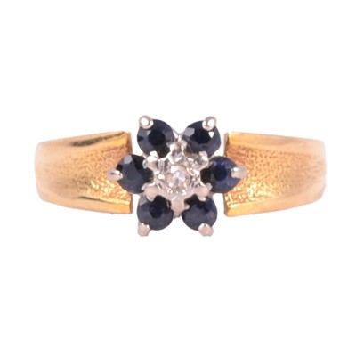 Lot 31 - A 1970's sapphire and diamond reverse cluster ring by Lawrence Henry.