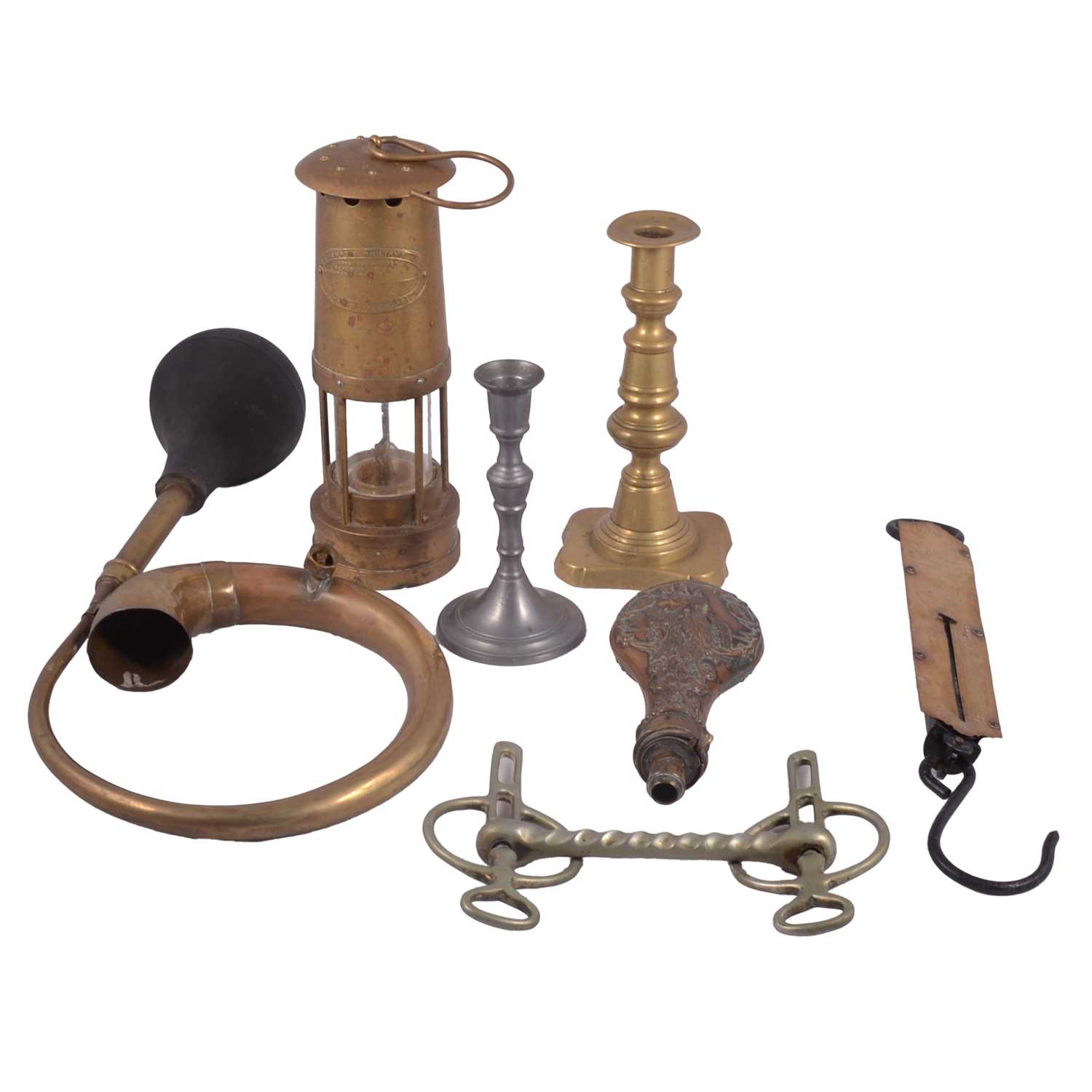 Lot 193 - Brass miner's lamp, candlesticks, car horn, spring balance, copper powder flask and other metalwares.