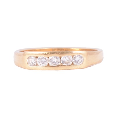 Lot 16 - A diamond five stone ring.