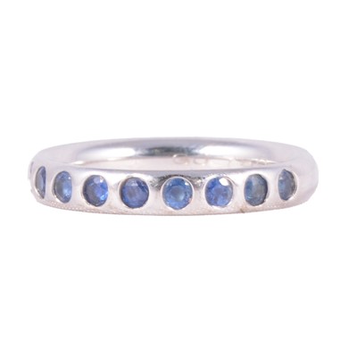 Lot 30 - Georg Jensen - a sapphire half hoop ring.