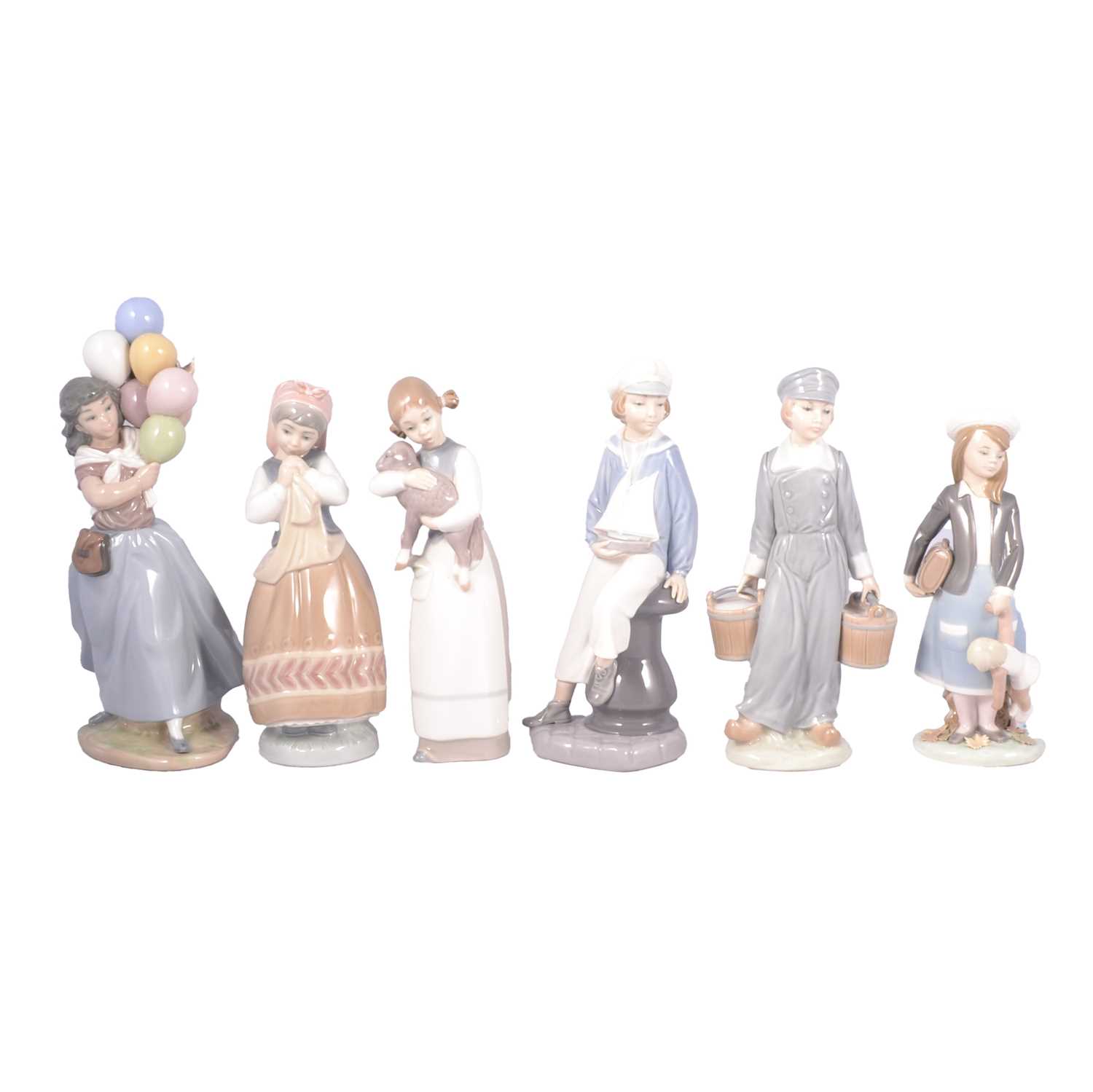 Lot 62 - Collection of thirteen Lladro figurines, mostly childhood series