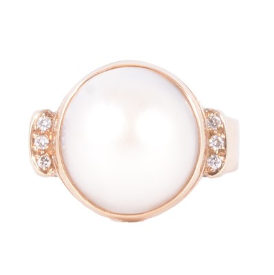 Lot 44 - A half pearl and diamond dress ring.