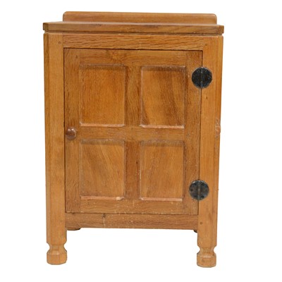 Lot 89 - Robert 'Mouseman' Thompson of Kilburn, an oak panelled bedside cupboard, 1970's