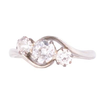 Lot 11 - A diamond three stone ring.