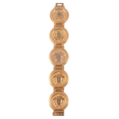 Lot 291 - Gianni Versace - a Medusa Coin gold-plated quartz bracelet wristwatch.
