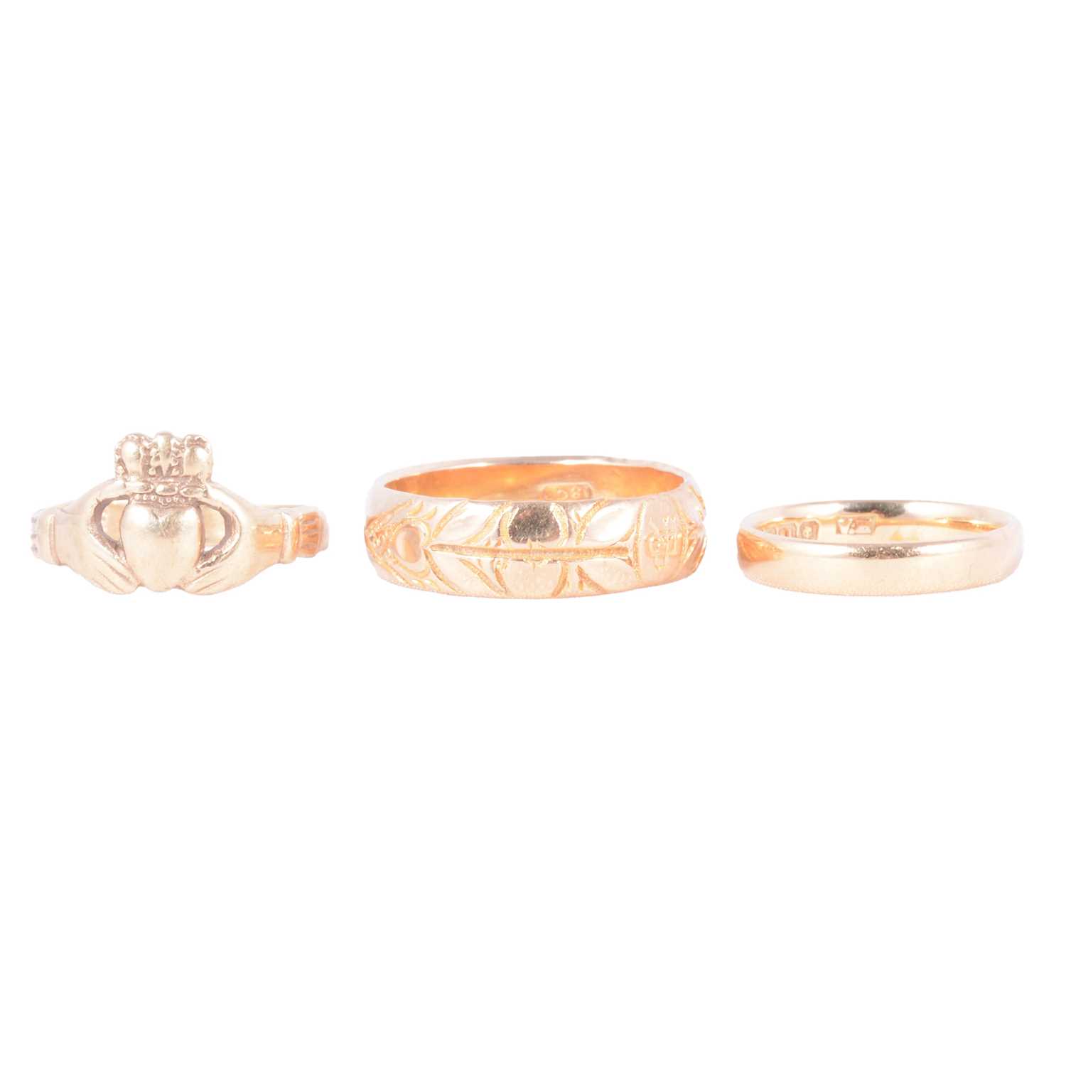 Lot 70 - Two gold wedding rings and a Claddagh ring.