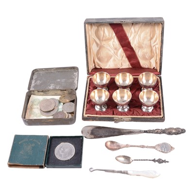 Lot 474 - Silver-handled shoehorn, white metal teaspoons, silver-plated eggcups, coins and banknotes.