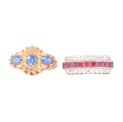 Lot 37 - A ruby and diamond ring and a sapphire and diamond ring.