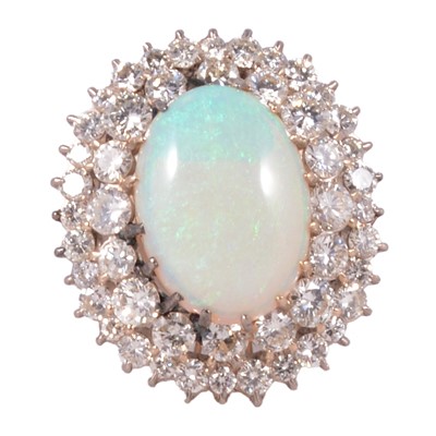 Lot 36 - An opal and diamond cluster ring.