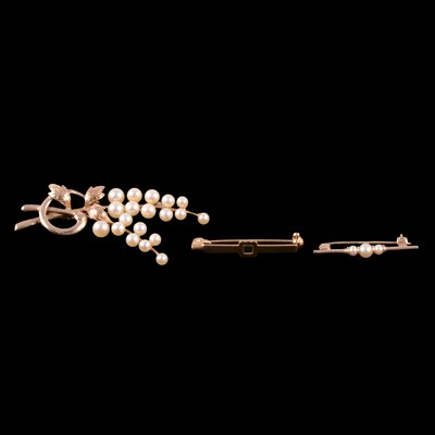 Lot 206 - Two cultured pearl brooches, and a brooch missing a stone.