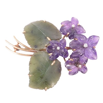 Lot 189 - An amethyst and jade floral design brooch.