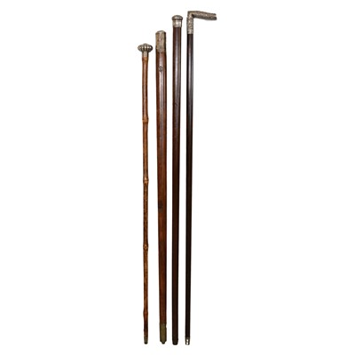 Lot 65 - Four silver mounted walking sticks