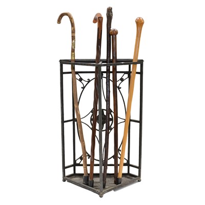 Lot 63 - Five walking sticks and an iron corner stick stand