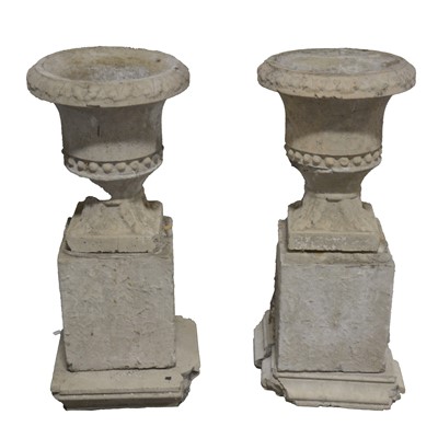 Lot 467 - Pair of concrete garden urns on block pedestals