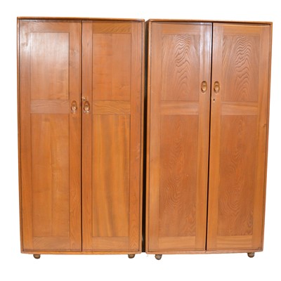 Lot 390 - Ercol, near pair of elm wardrobes