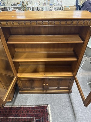 Lot 397 - Ercol mid-elm two door bookcase