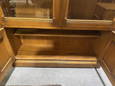 Lot 397 - Ercol mid-elm two door bookcase