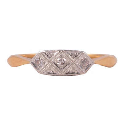 Lot 100 - A diamond three stone ring.