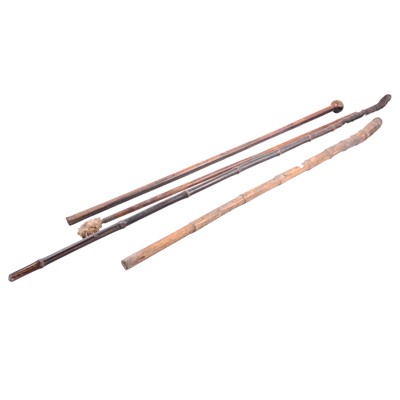 Lot 127 - Hardwood knobkerrie/ walking stick, two bamboo sticks, and a gun cleaning rod