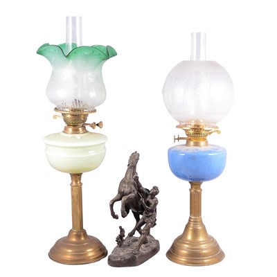 Lot 458 - Two Edwardian oil lamps and a spelter Marley horse model