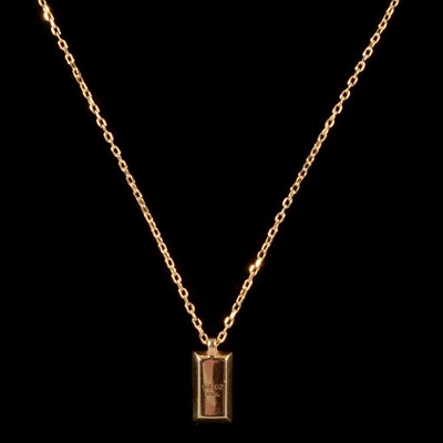 Lot 329 - A 9 carat yellow gold ingot pendant on a chain.