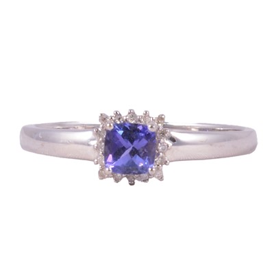 Lot 42 - A tanzanite and diamond square cluster ring.