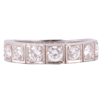 Lot 104 - A diamond half eternity ring.