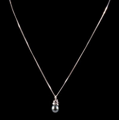 Lot 304 - A Tahitian cultured pearl and diamond pendant on a chain.