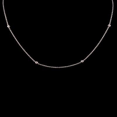 Lot 286 - A 9 carat white gold chain necklace set with seven diamonds.