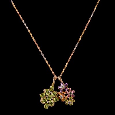 Lot 315 - A peridot and diamond pendant on a gold chain, and a multi-coloured gemset pendant.