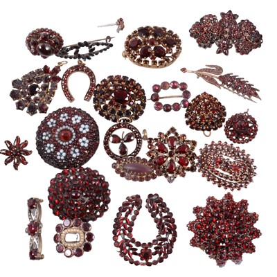 Lot 394 - Twenty-four Georgian and later garnet brooches, pendants and stick pins.