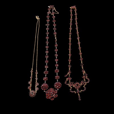 Lot 393 - Three garnet cluster necklaces.