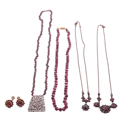 Lot 392 - Four garnet necklaces, and a pair of garnet earscrews.