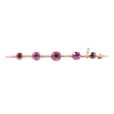 Lot 200 - A pink sapphire bar brooch.