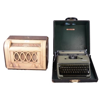 Lot 221 - HMV walnut and bakelite cased radio and a vintage Olympia typewriter.