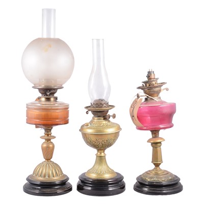 Lot 144 - Three Victorian brass oil lamps