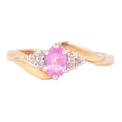 Lot 29 - A pink sapphire and diamond ring.