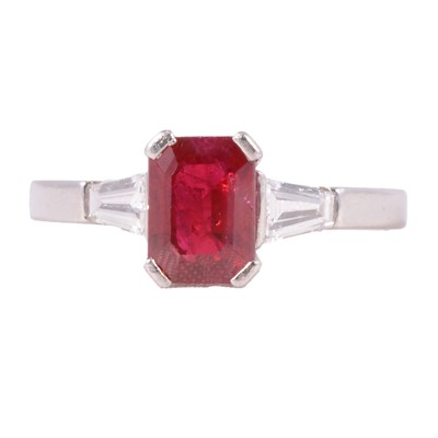 Lot 8 - A ruby and diamond three stone ring.