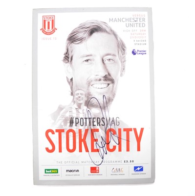 Lot 64 - Stoke City vs Manchester United matchday programme, signed by Peter Crouch