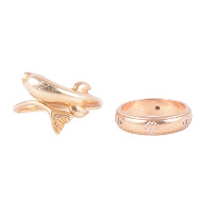 Lot 136 - A yellow metal dolphin ring, and 9 carat gold wedding band.