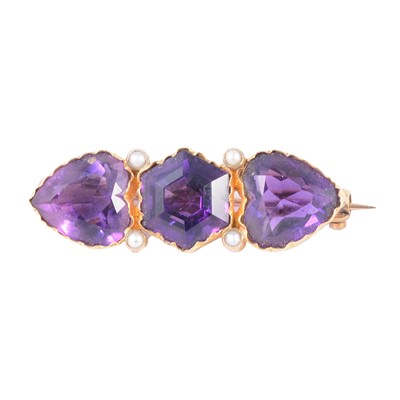 Lot 198 - A three stone amethyst brooch.