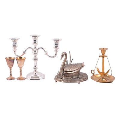 Lot 161 - A brass fireside companion set, swan ashtray, onyx, six bottle cruet.