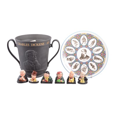 Lot 57 - A Royal Doulton Limited Edition black jasper Charles Dickens loving cup and other Dickens figures.