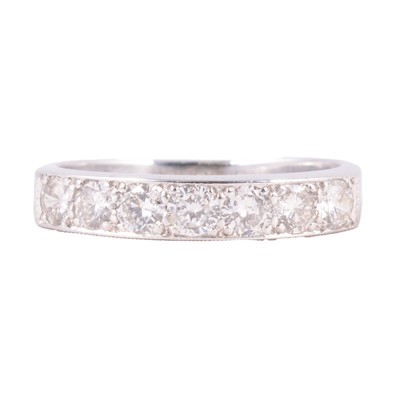 Lot 103 - A diamond half eternity ring.