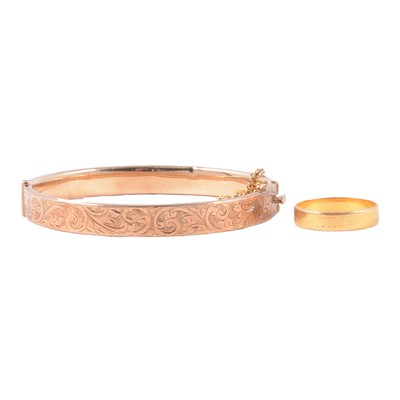 Lot 213 - A 9 carat yellow gold bangle, and 22 carat gold ring.