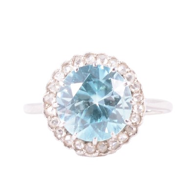 Lot 30 - A heat treated blue zircon and diamond ring.