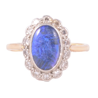 Lot 37 - An opal and diamond cluster ring.