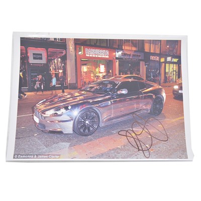 Lot 471 - Signed Jermaine Pennant A4 colour photograph, inside Aston Martin